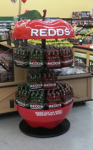 The display in the field is fully loaded with Redd's Apple Ale and Strawberry Ale product — matching the approved render and ready to drive impulse purchases at retail.